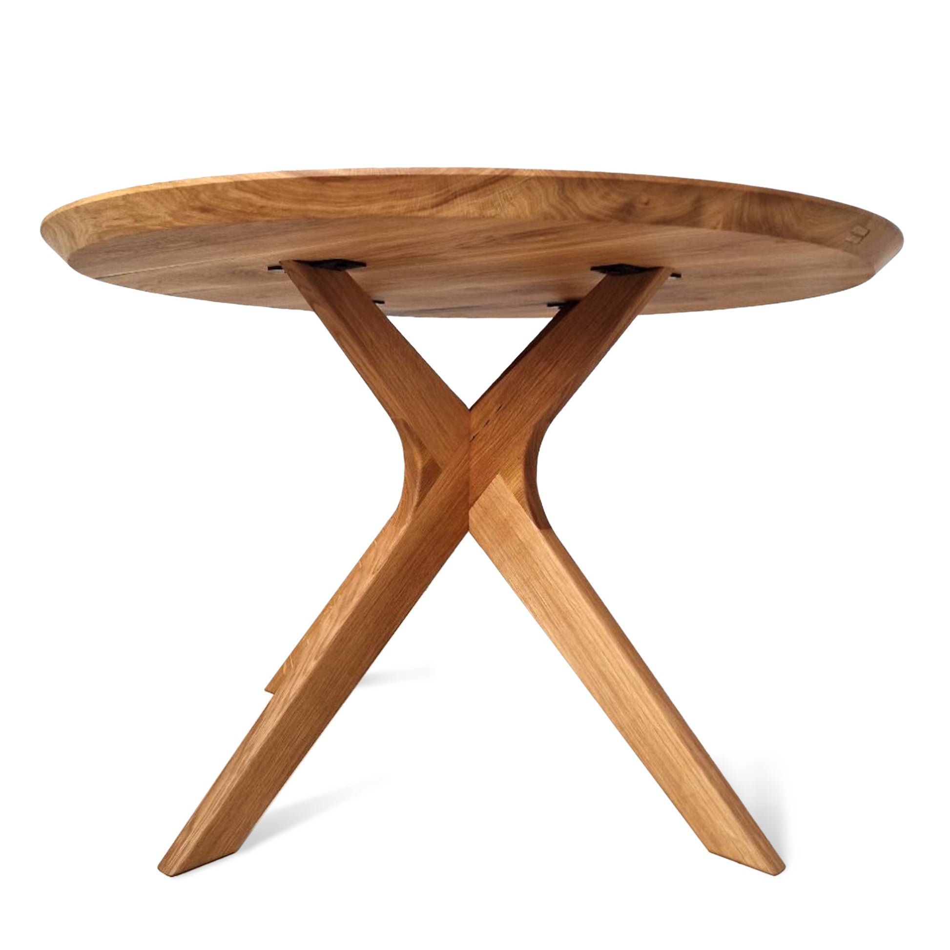 Vera extendable round dining table in clear oak with solid wood spider legs, natural finish, middle extension, 3cm thick top, handcrafted from FSC-certified solid oak, customizable size, color, and edge.