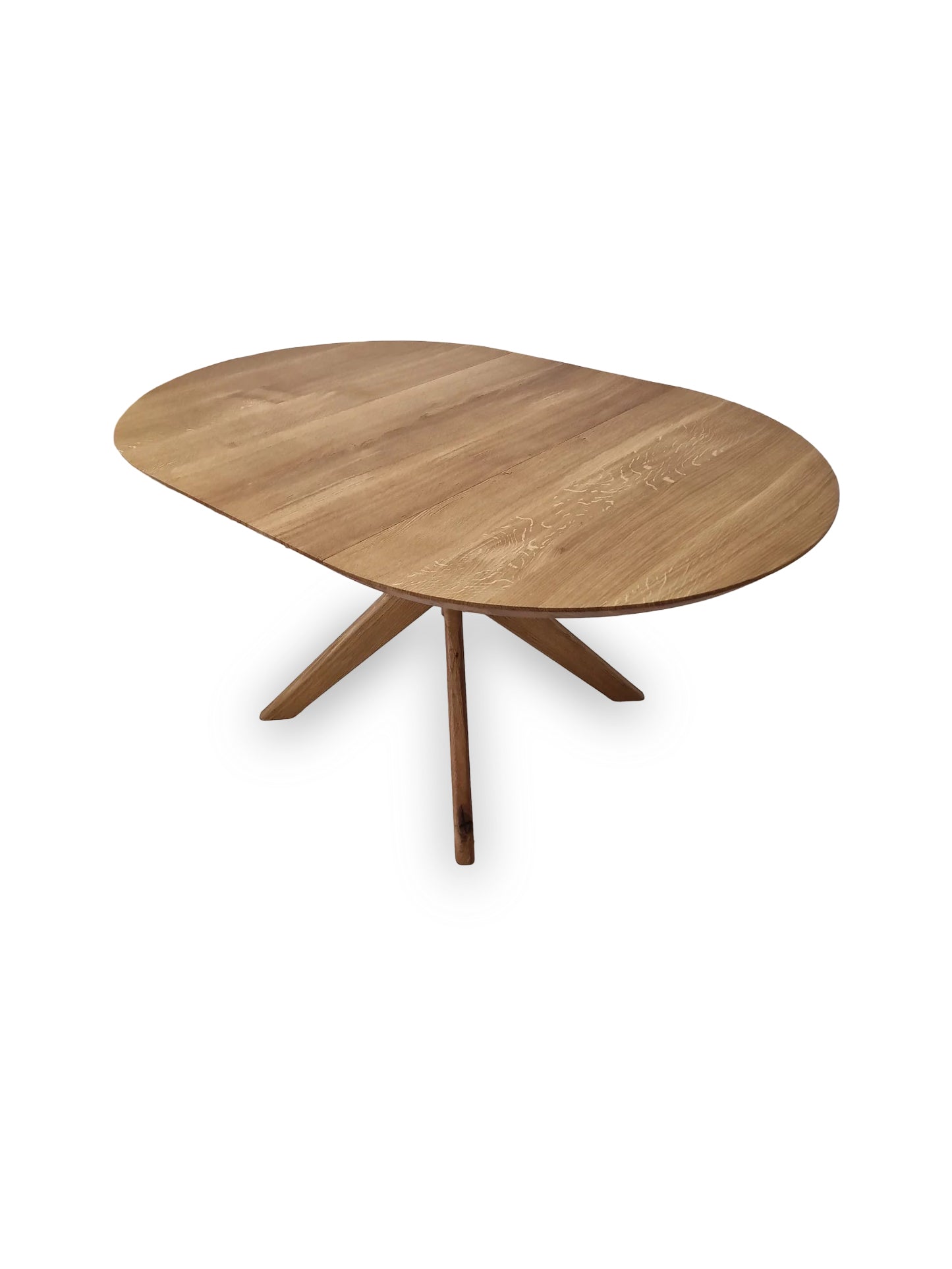 Vera extendable round dining table in clear oak with solid wood spider legs, natural finish, middle extension, 3cm thick top, handcrafted from FSC-certified solid oak, customizable size, color, and edge.