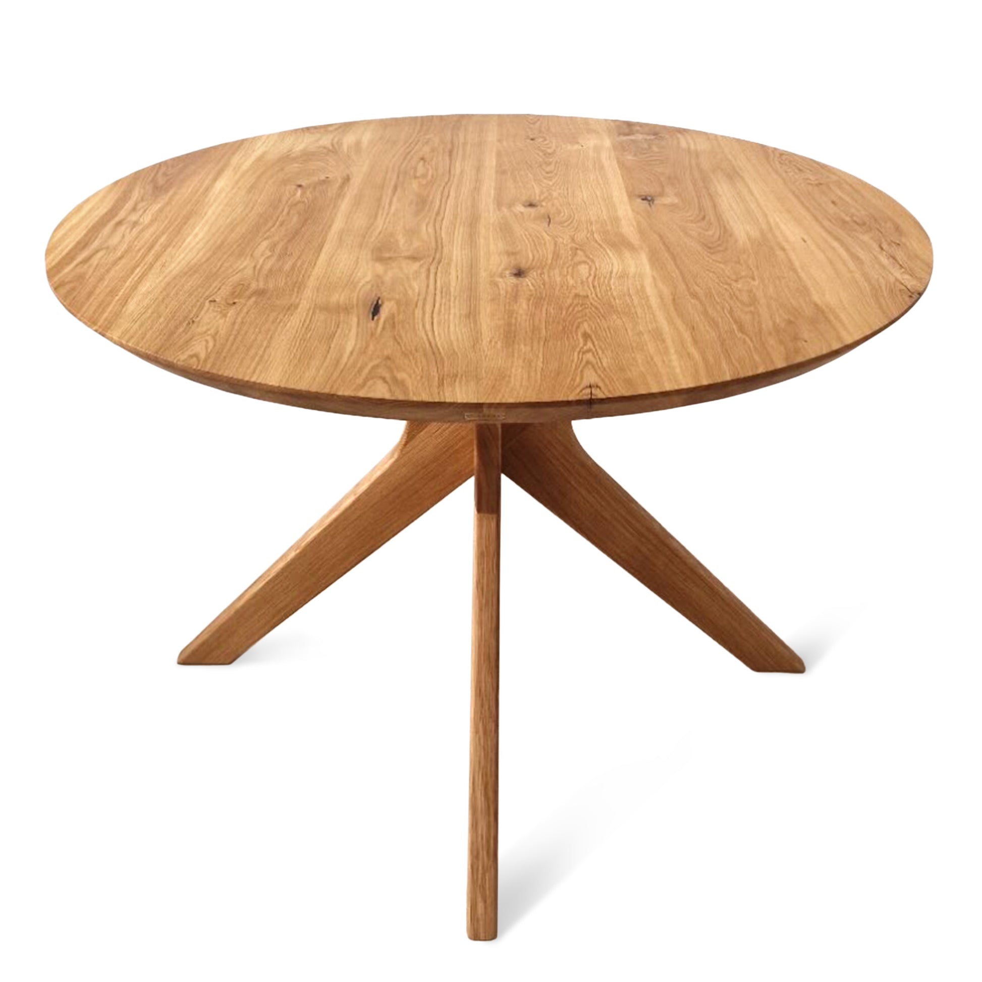 Vera extendable round dining table in clear oak with solid wood spider legs, natural finish, middle extension, 3cm thick top, handcrafted from FSC-certified solid oak, customizable size, color, and edge.